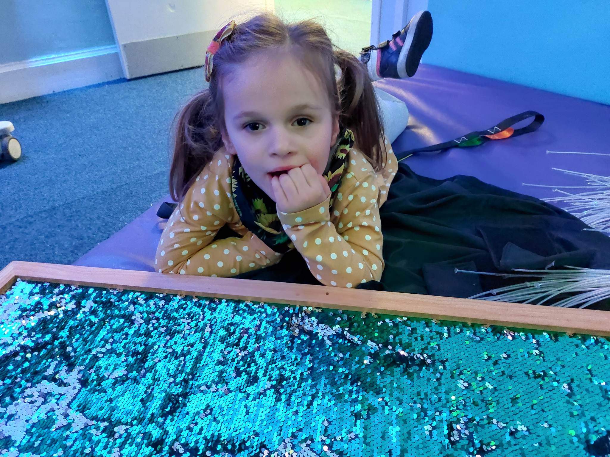 Young person enjoying time in the sensory room